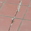Before: damaged tile patio